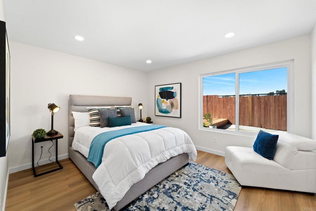 5055 Andrew Jackson Street Oceanside, CA 92057 - Photo 26 of 43 a bedroom with a large bed and a couch