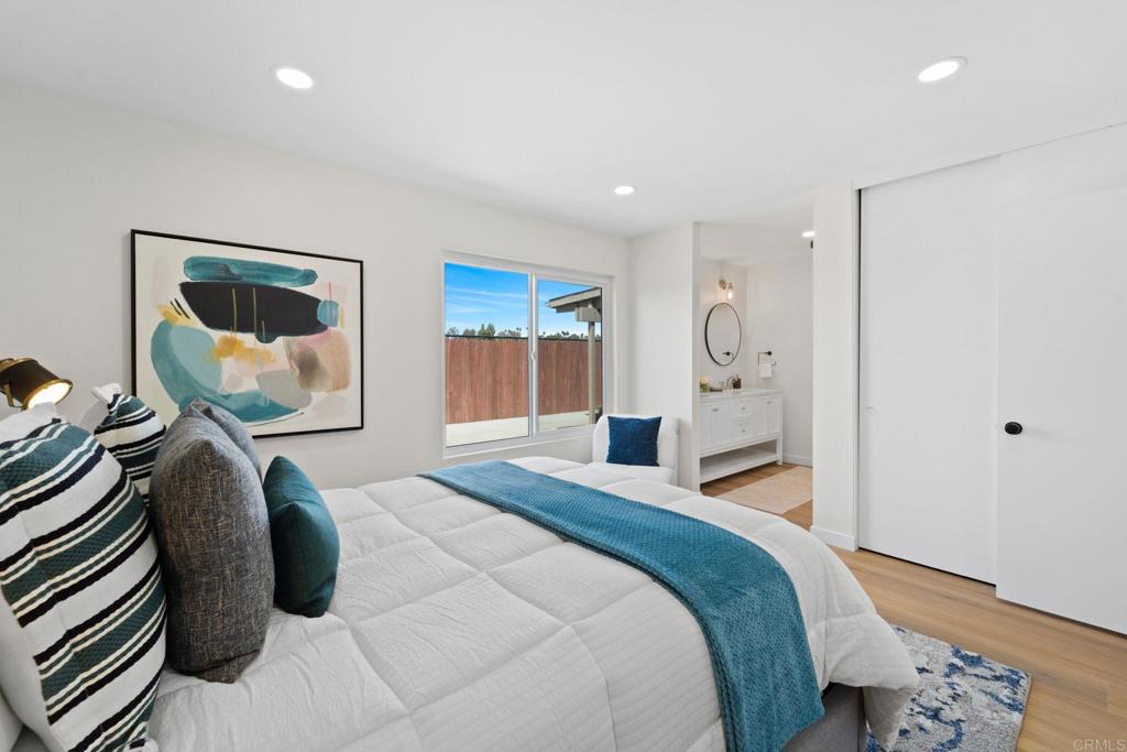 5055 Andrew Jackson Street Oceanside, CA 92057 - Photo 27 of 43 a bedroom with a bed and wooden floor