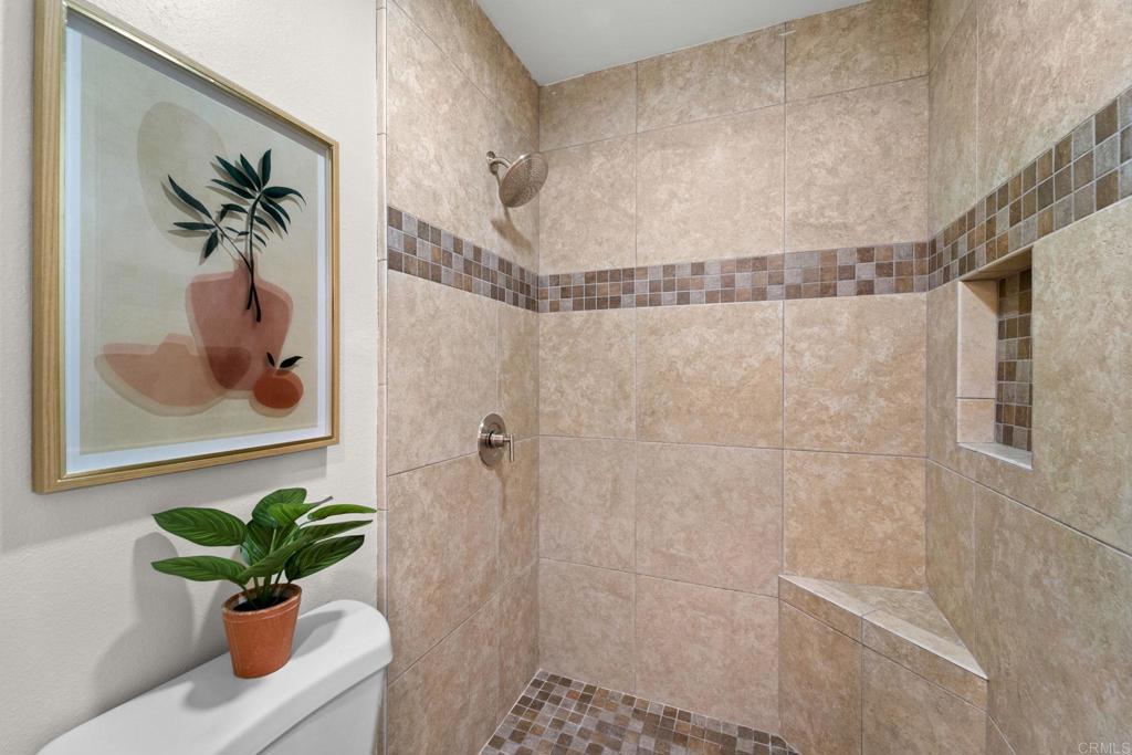 5055 Andrew Jackson Street Oceanside, CA 92057 - Photo 30 of 43 a bath room with a bathtub and a shower
