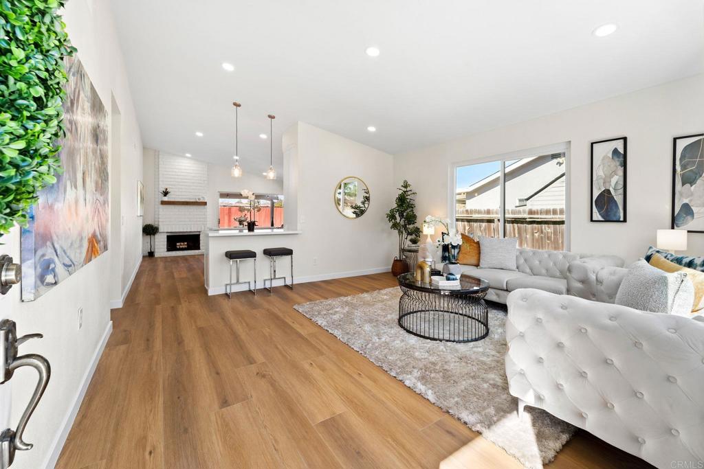 5055 Andrew Jackson Street Oceanside, CA 92057 - Photo 3 of 43 a living room with furniture and a wooden floor