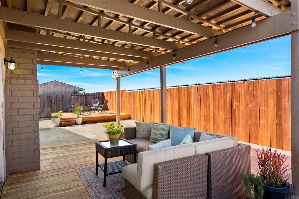 5055 Andrew Jackson Street Oceanside, CA 92057 - Photo 32 of 43 a view of a patio with a table and chairs