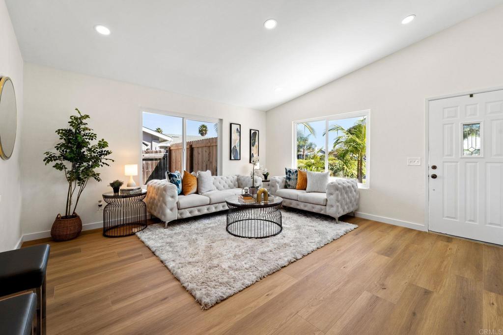 5055 Andrew Jackson Street Oceanside, CA 92057 - Photo 5 of 43 a living room with furniture and a potted plant