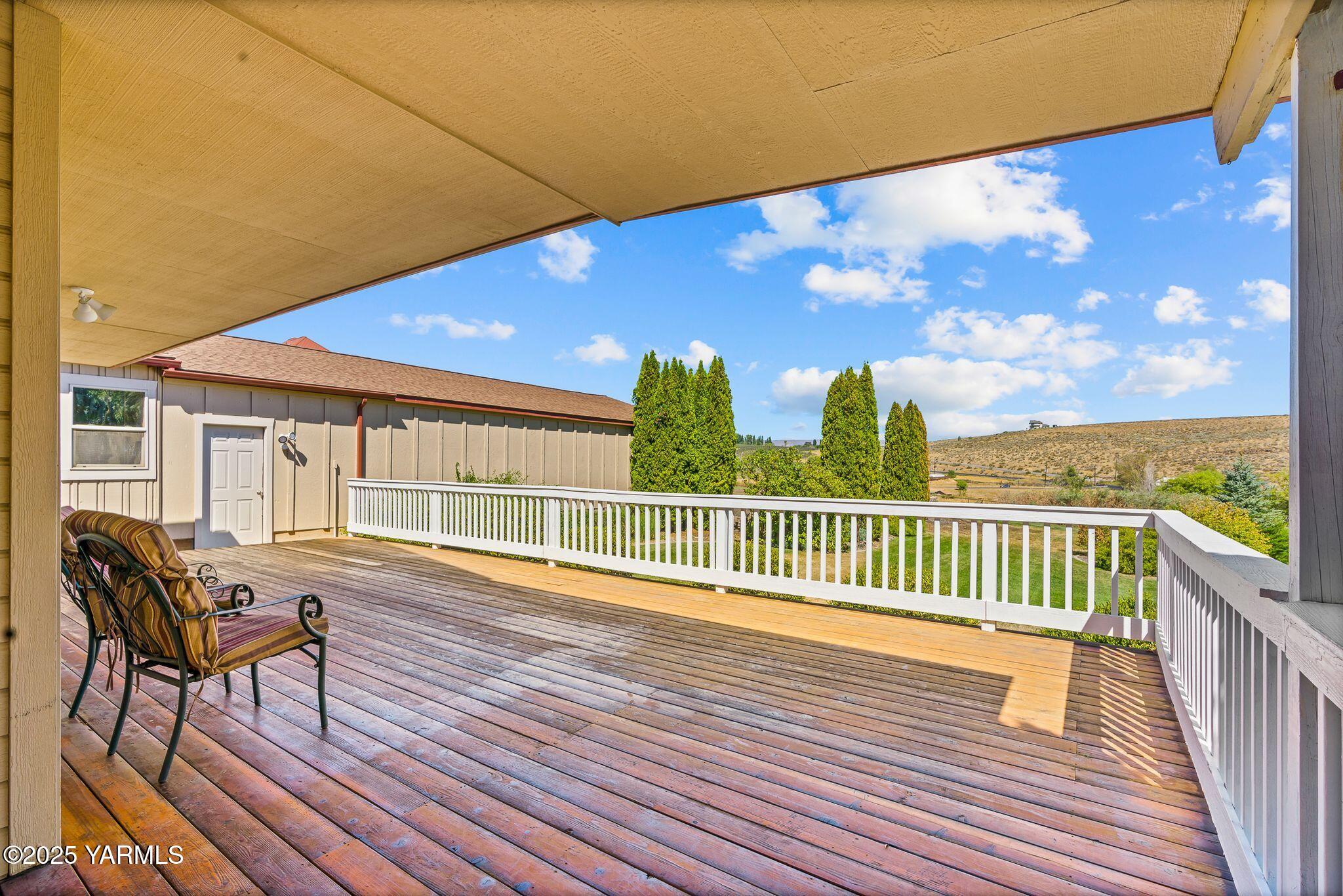 12001 Marble Road Yakima, WA 98908 - Photo 6 of 40 a view of a chairs and table on the wooden floor