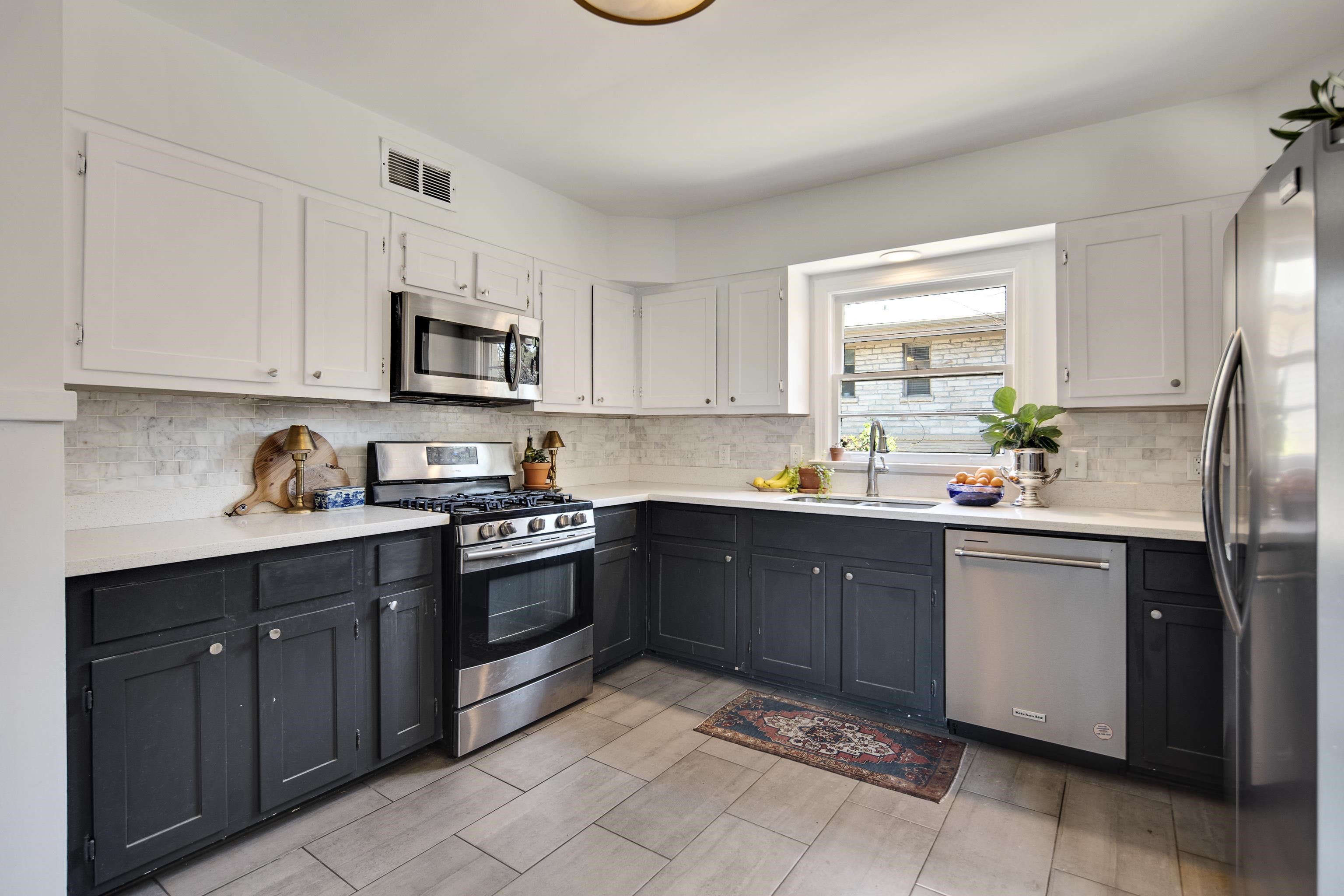 4063 Minden Road Memphis, TN 38117 - Photo 12 of 35 a kitchen with stainless steel appliances granite countertop a sink and cabinets