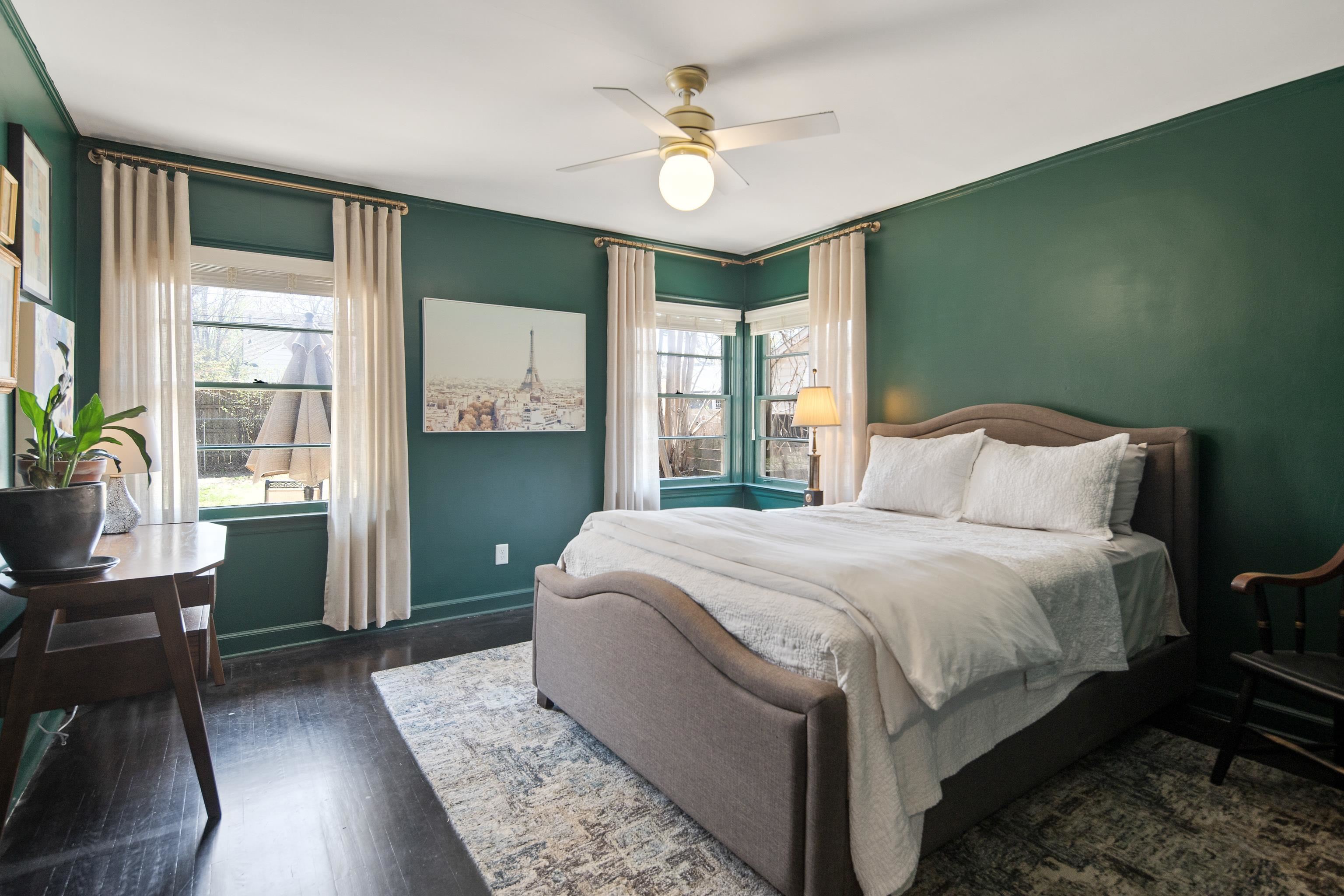 4063 Minden Road Memphis, TN 38117 - Photo 24 of 35 a bedroom with a large bed and a chandelier