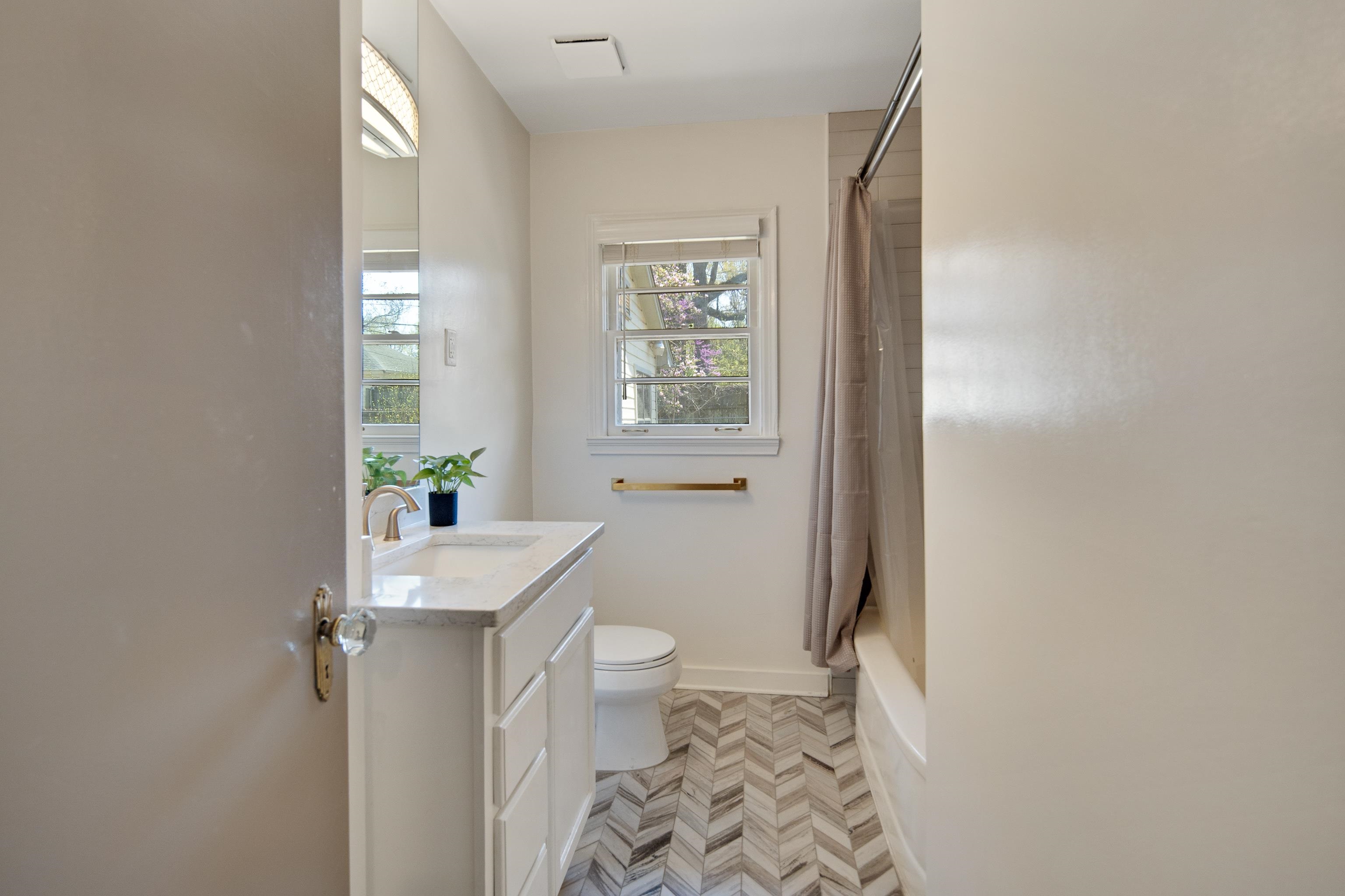 4063 Minden Road Memphis, TN 38117 - Photo 26 of 35 a bathroom with a granite countertop sink toilet and shower