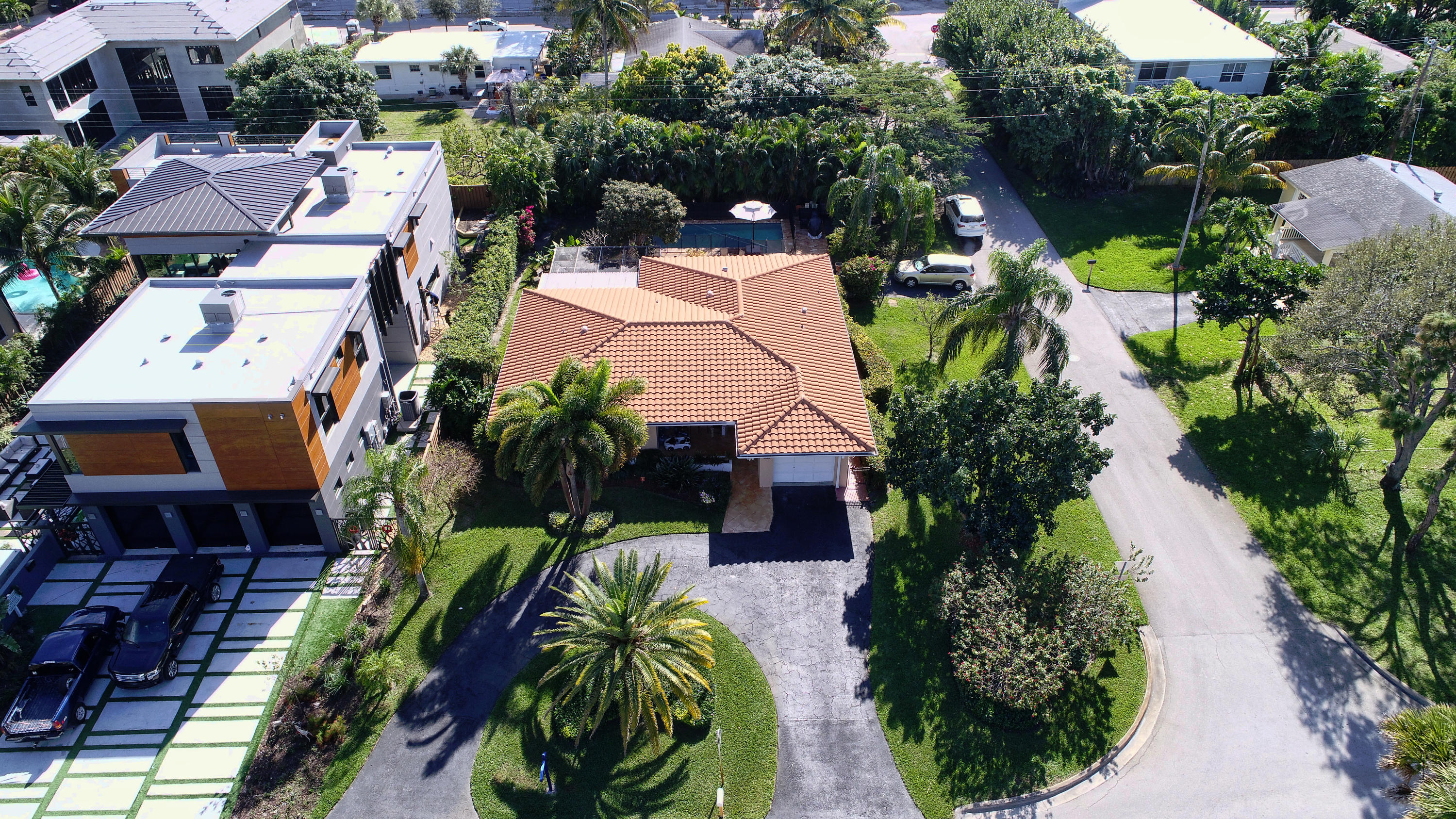 400 Northeast 2nd Street Boca Raton, FL 33432 - Photo 1 of 40 an aerial view of a house with a yard swimming pool a patio and lake view