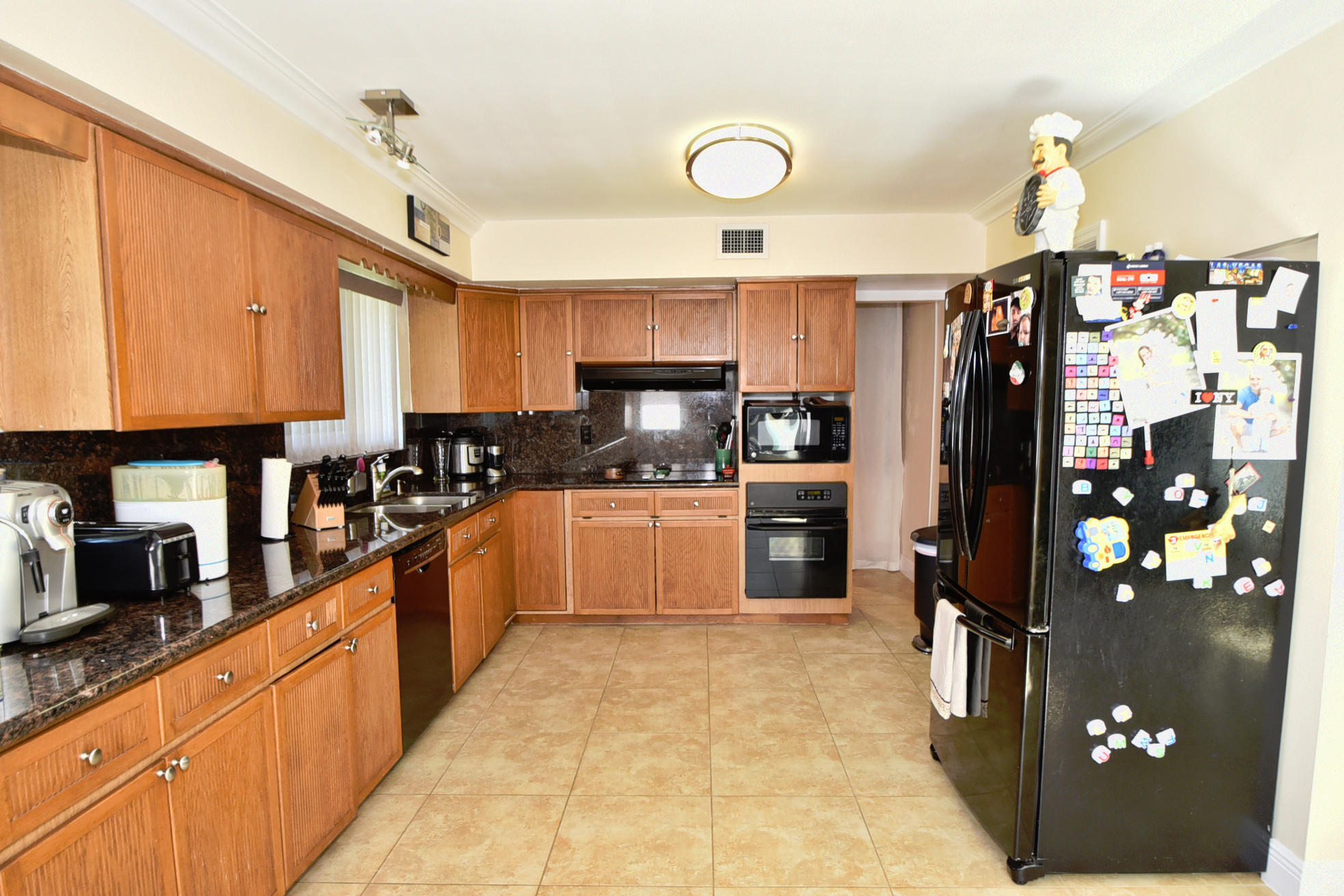400 Northeast 2nd Street Boca Raton, FL 33432 - Photo 15 of 40 a large kitchen with stainless steel appliances granite countertop a refrigerator and a stove top oven