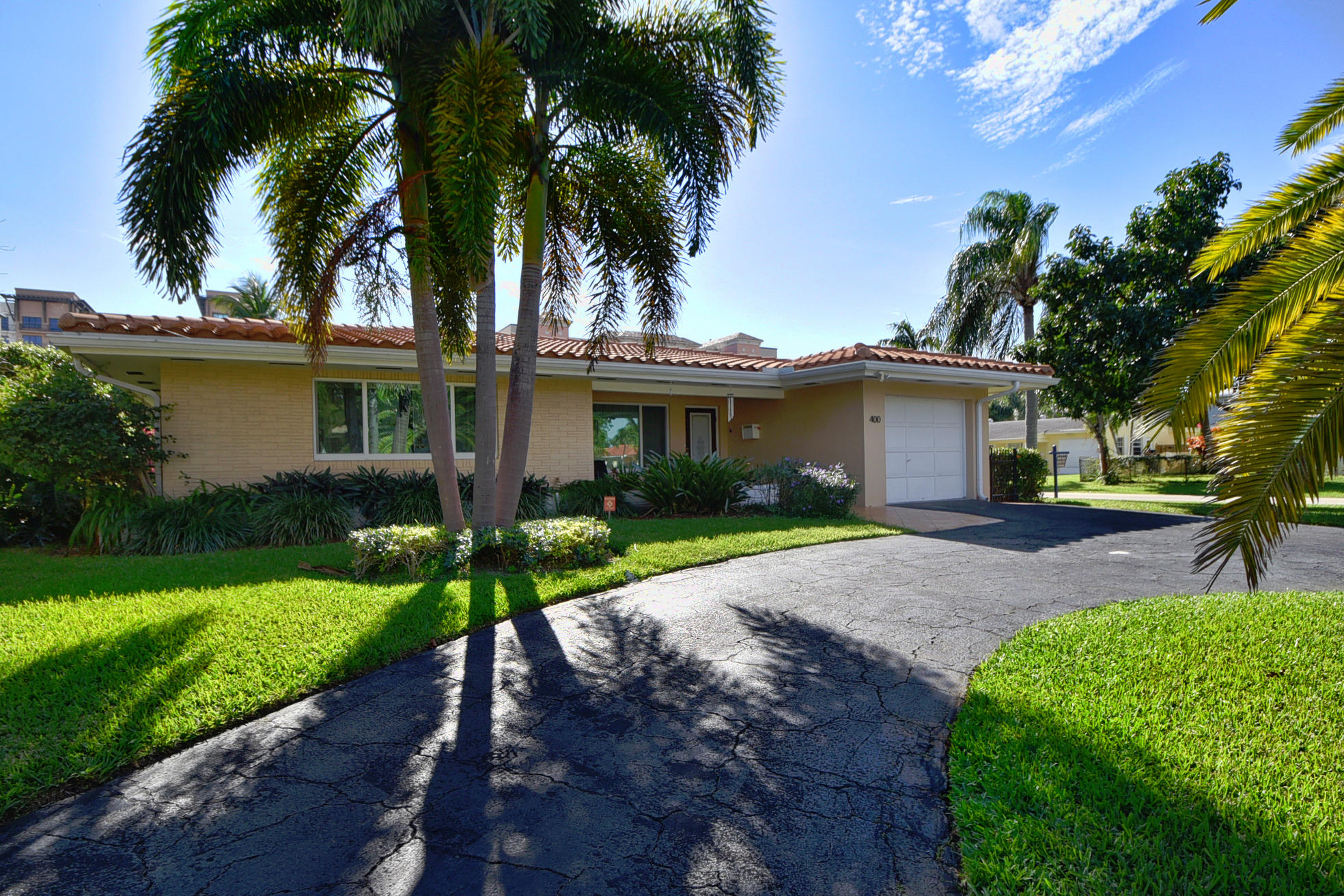 400 Northeast 2nd Street Boca Raton, FL 33432 - Photo 2 of 40 a view of a house with a yard and potted plants