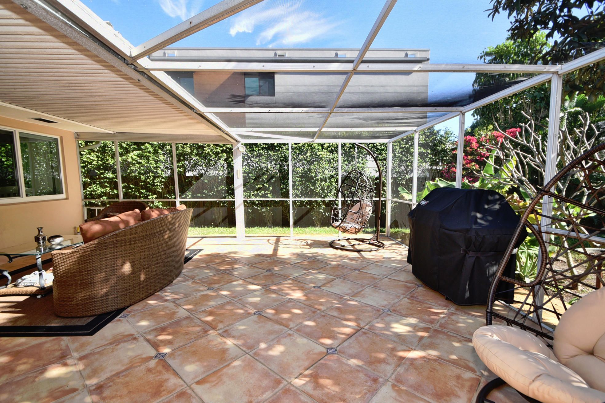 400 Northeast 2nd Street Boca Raton, FL 33432 - Photo 27 of 40 a living room with patio furniture and a floor to ceiling window