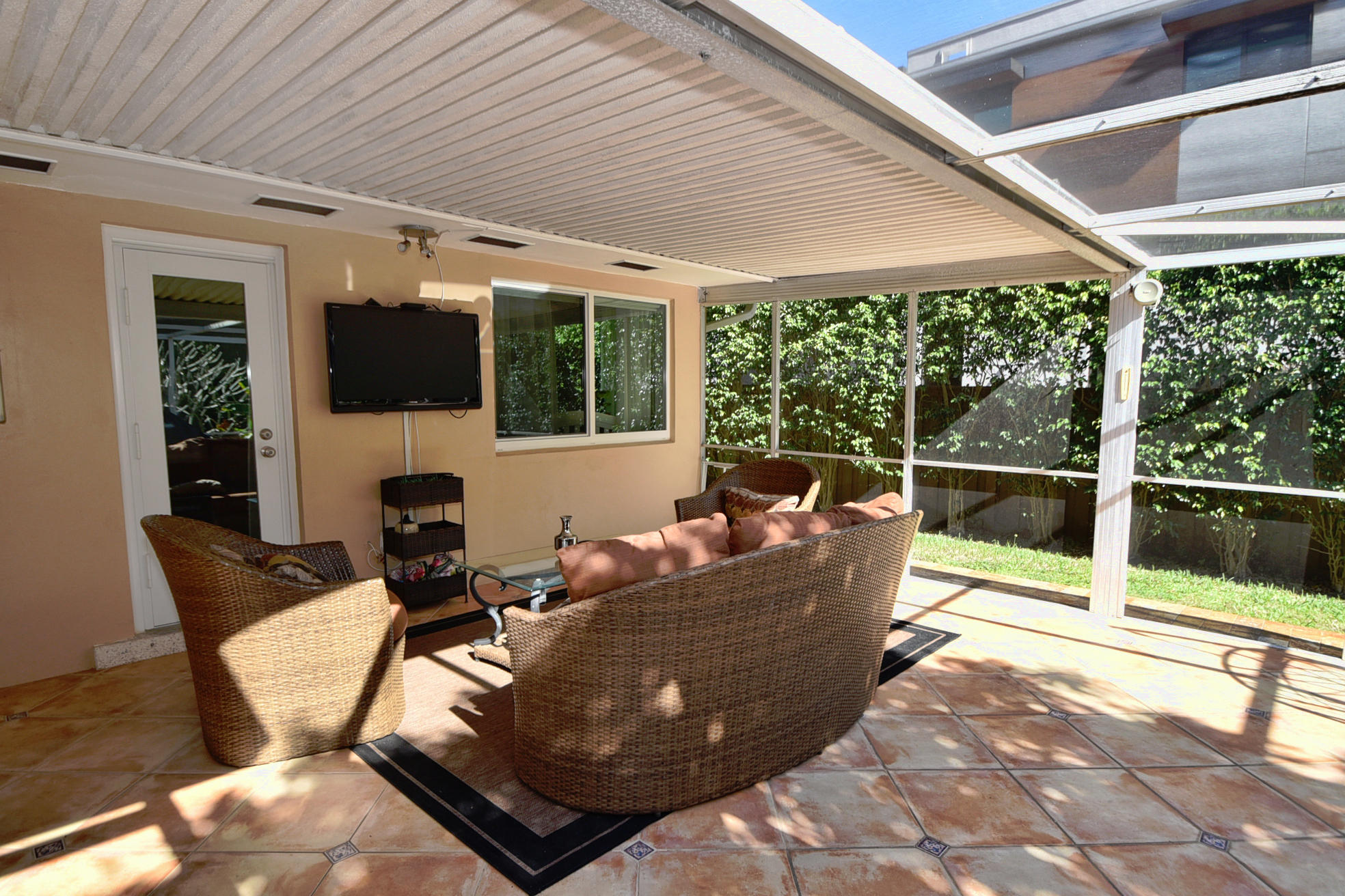 400 Northeast 2nd Street Boca Raton, FL 33432 - Photo 28 of 40 a living room with furniture tv and a large window