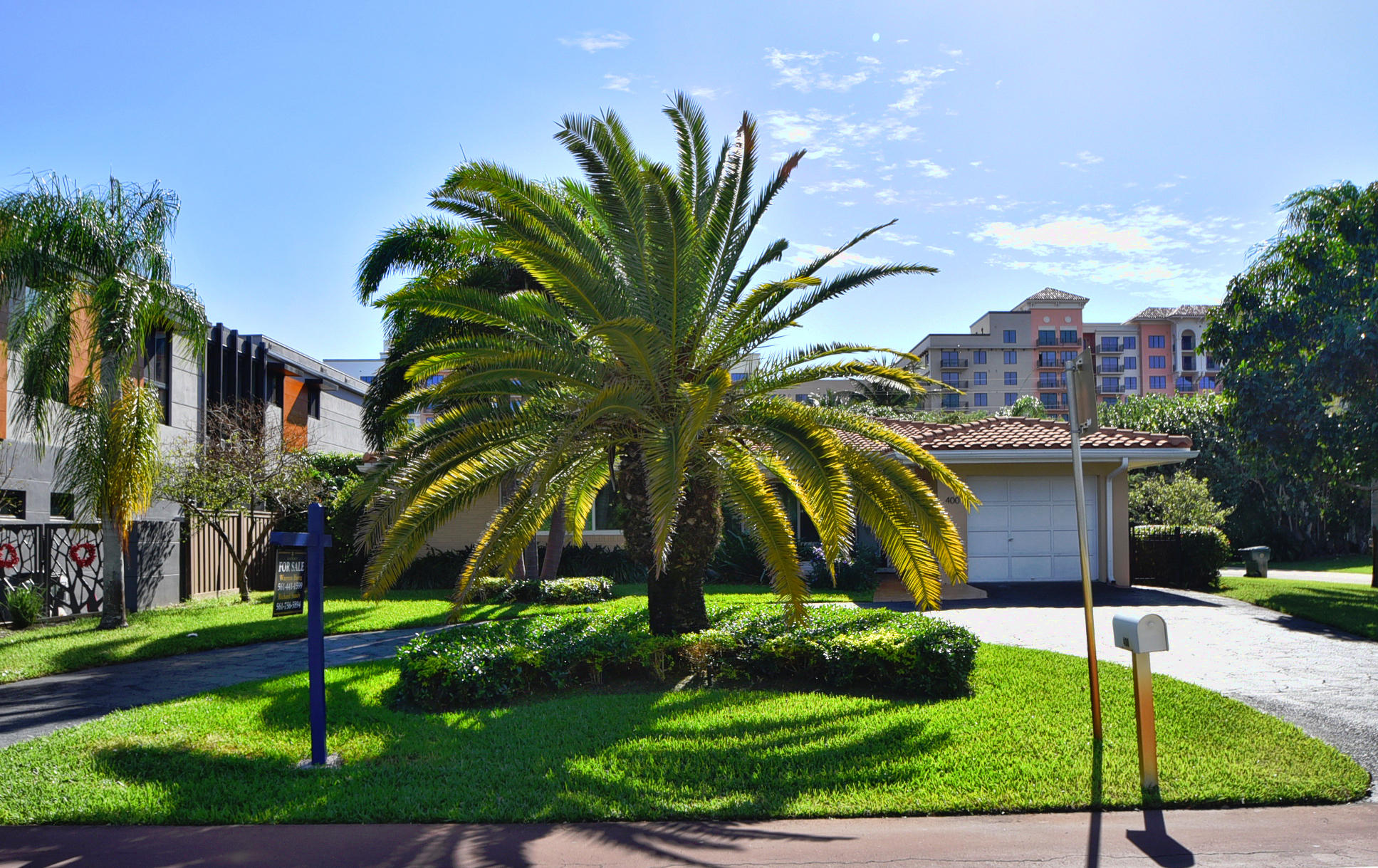 400 Northeast 2nd Street Boca Raton, FL 33432 - Photo 3 of 40 a view of a palm trees front of house with a yard