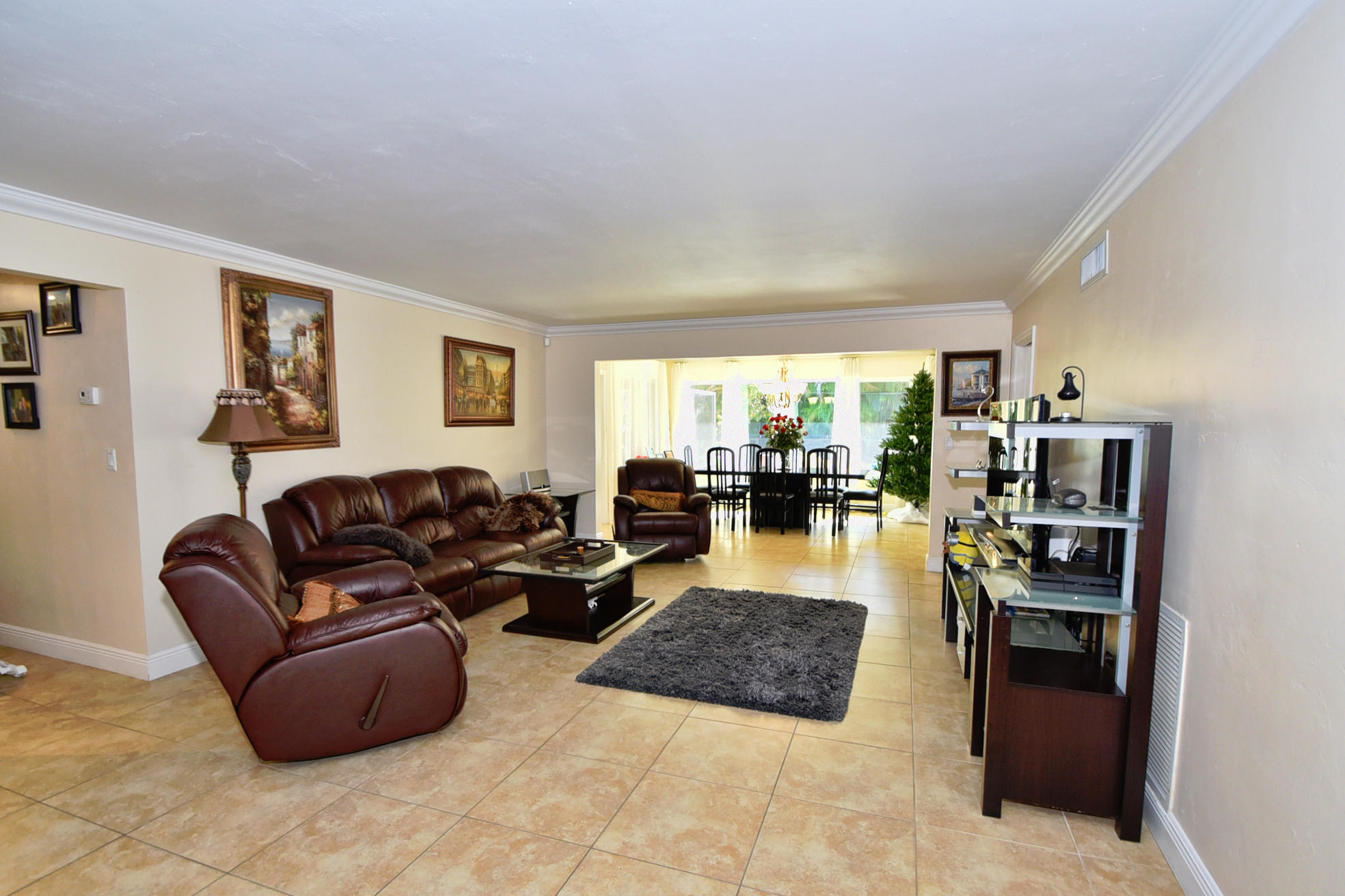 400 Northeast 2nd Street Boca Raton, FL 33432 - Photo 7 of 40 a living room with furniture and a flat screen tv
