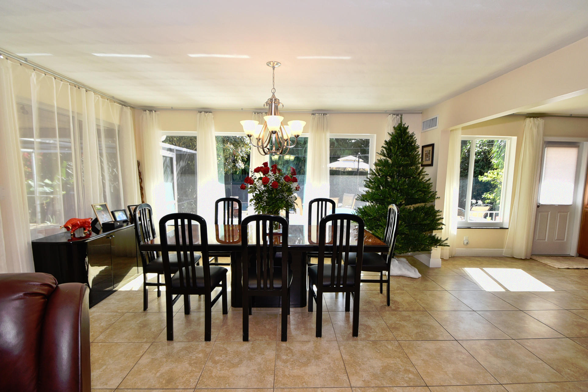 400 Northeast 2nd Street Boca Raton, FL 33432 - Photo 10 of 40 a view of a dining room with furniture and chandelier