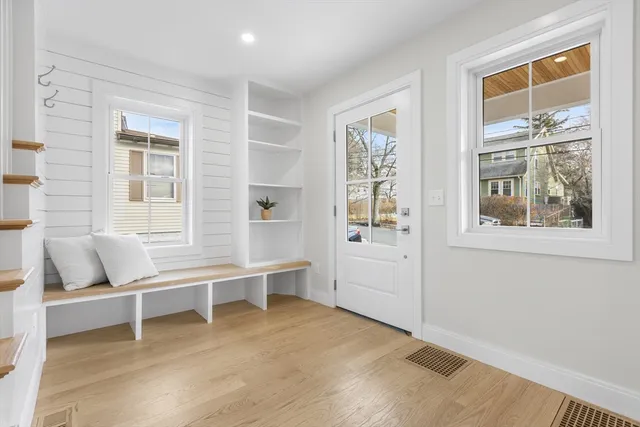 a living room with furniture and windows