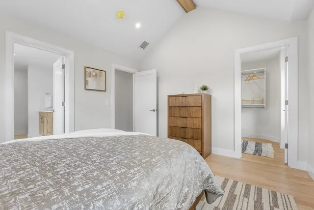 a bedroom with a bed and a cabinets