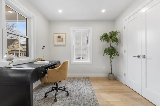 a workspace with furniture and a window