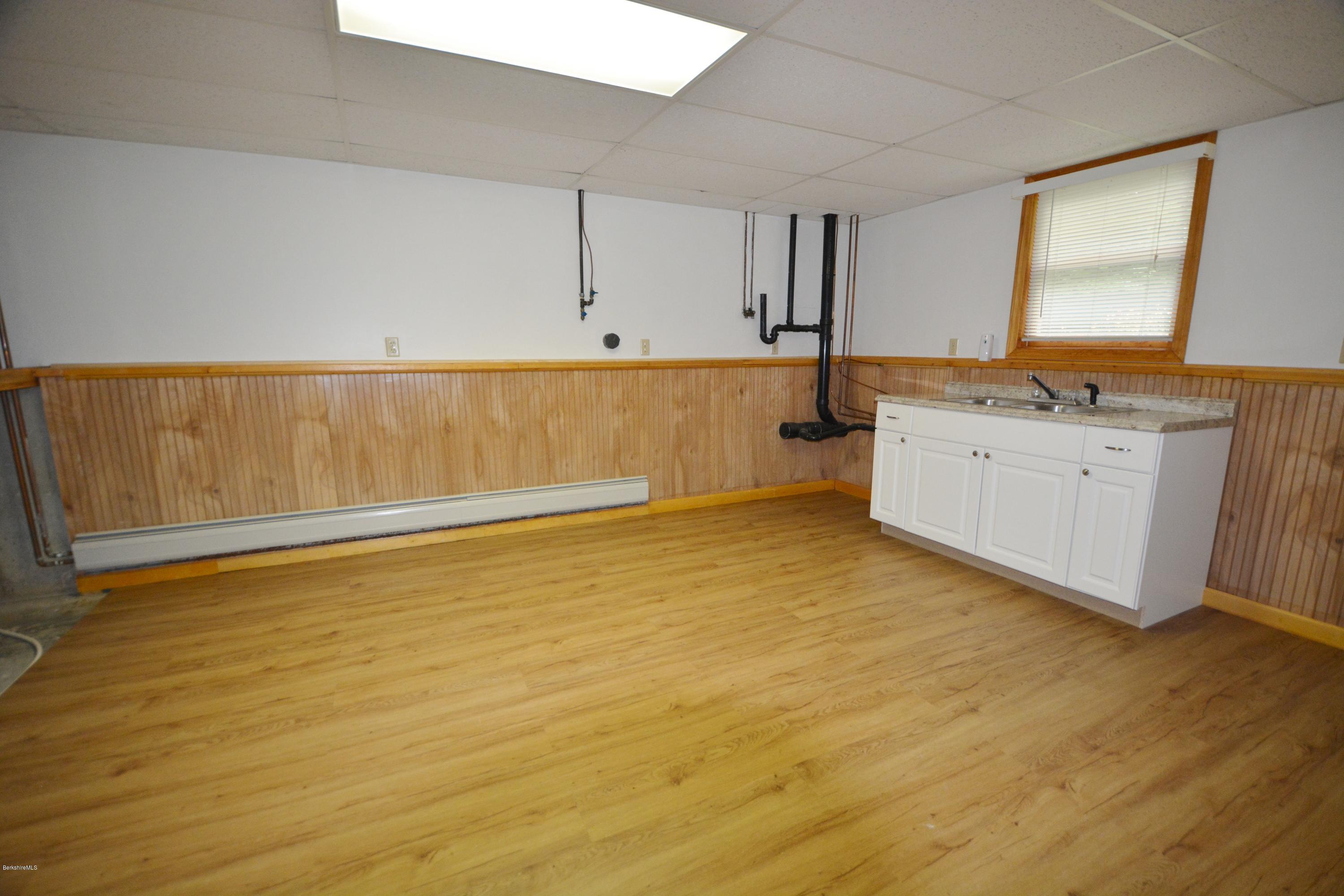 189 Tolland Road Otis, MA 01029 - Photo 11 of 16 a view of a kitchen with wooden floor