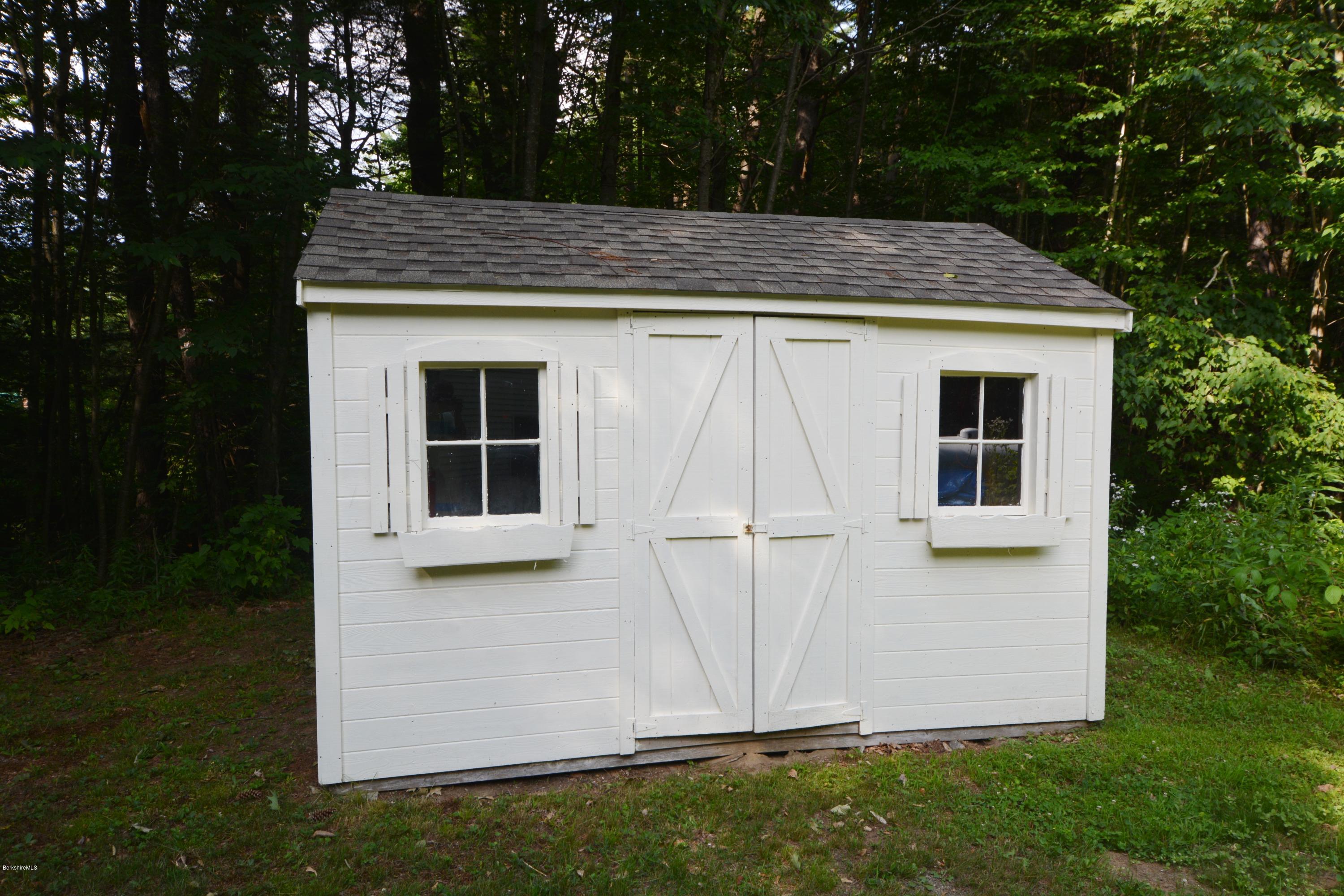 189 Tolland Road Otis, MA 01029 - Photo 13 of 16 a view of backyard of house and garden