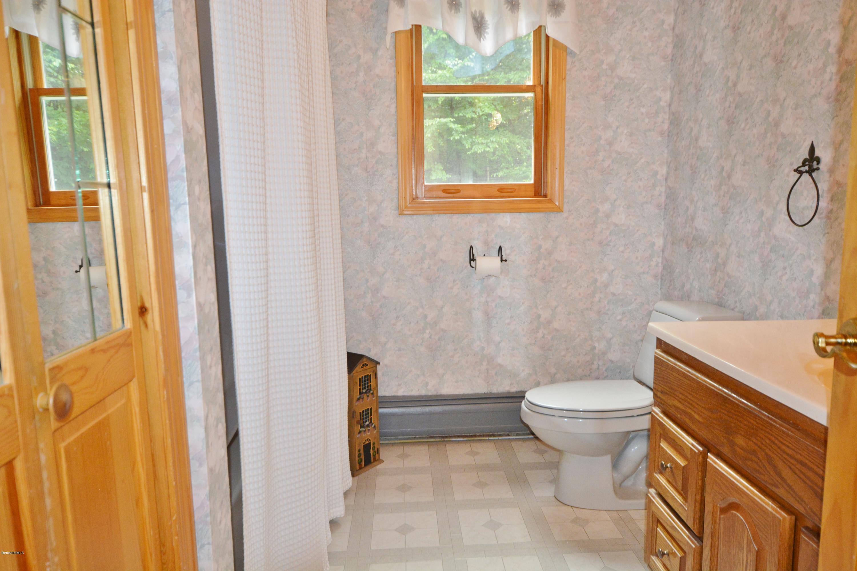 189 Tolland Road Otis, MA 01029 - Photo 7 of 16 a bathroom with a sink toilet and shower