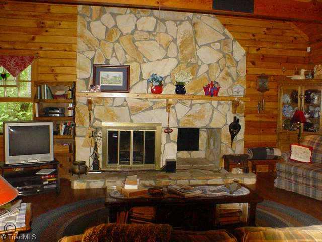 1500 Oscar Frye Road Pinnacle, NC 27043 - Photo 3 of 9 Other. Open living room with beautiful rock fireplace for those cool winter evenings.