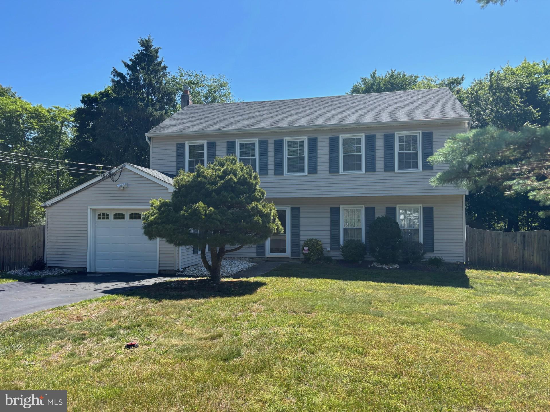 20 Bock Boulevard Howell, NJ 07731 - Photo 1 of 32 a front view of house with yard and trees