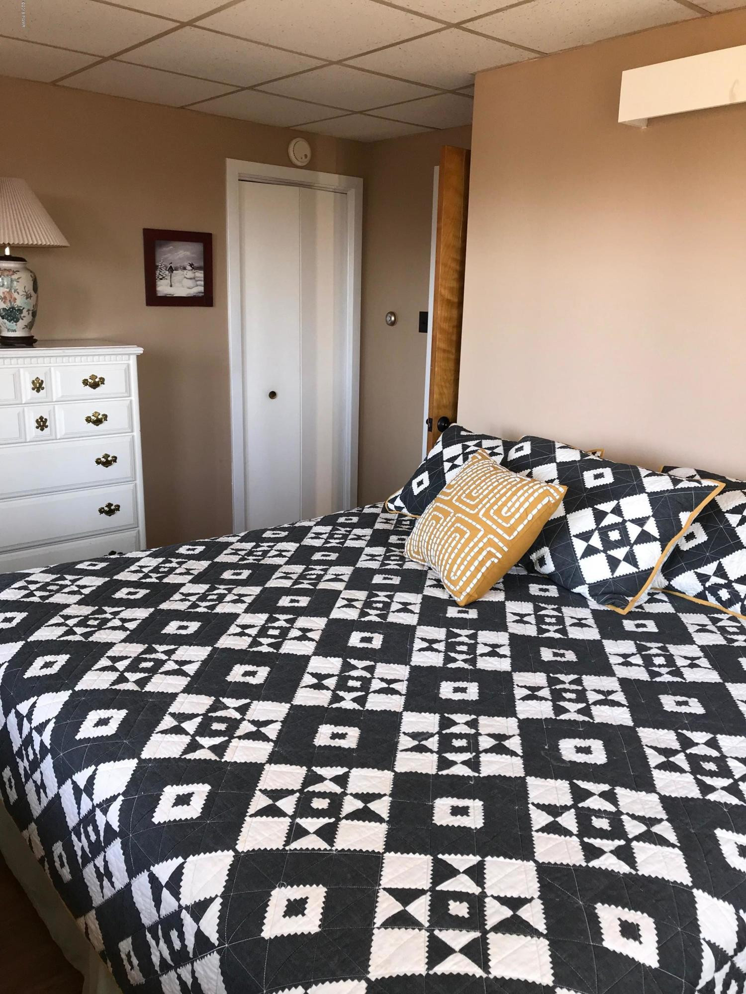 819 Wargo Road Union Dale, PA 18470 - Photo 31 of 49 a bedroom with a bed and a mirror