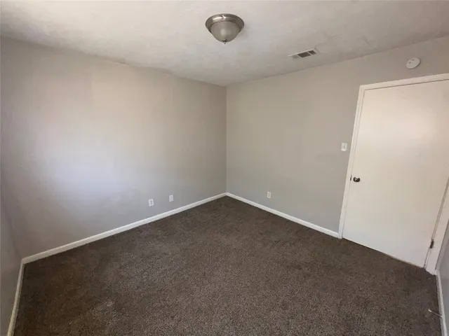 an empty room with a workbench