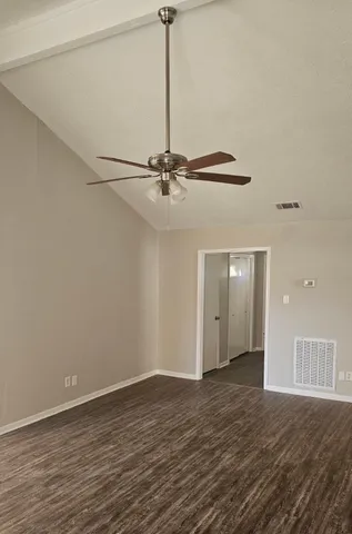 a view of a room with wooden floor