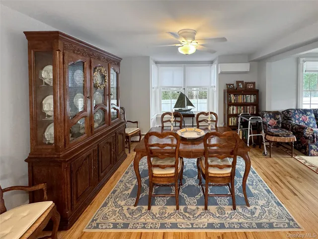 a dining room with furniture and window
