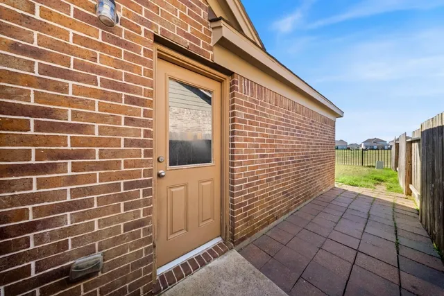 a view of a backyard with sitting area
