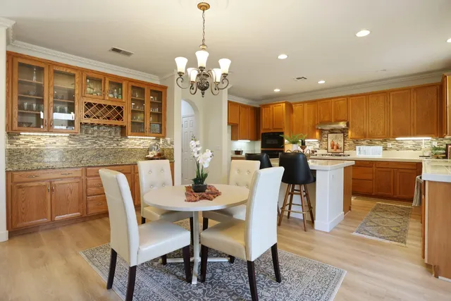 a kitchen with a sink stove and microwave