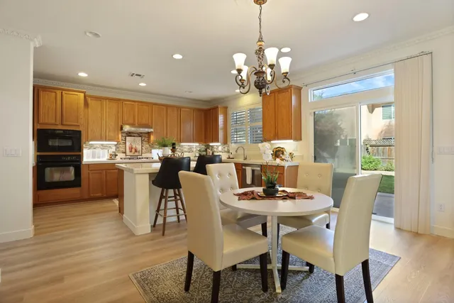 a kitchen with a sink cabinets and window