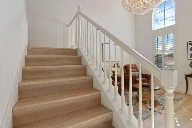 a view of a livingroom with furniture and a window