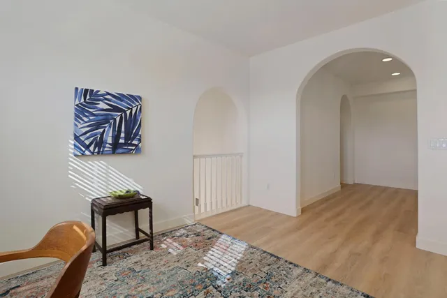 a bathroom with double vanity sinks a vanity a lamp and a mirror