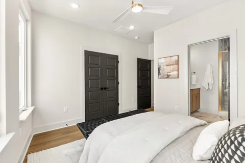 a bedroom with a bed and a dresser