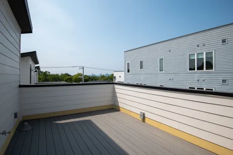 a view of front door and deck of house
