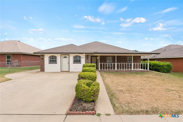 front view of a house with yard