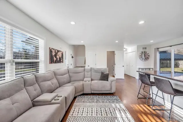 a living room with furniture and a rug