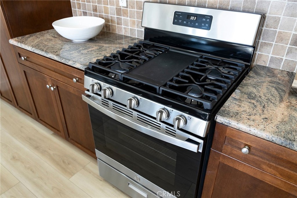 74 Townsend Irvine, CA 92620 - Photo 16 of 31 a stove top oven sitting inside of a kitchen