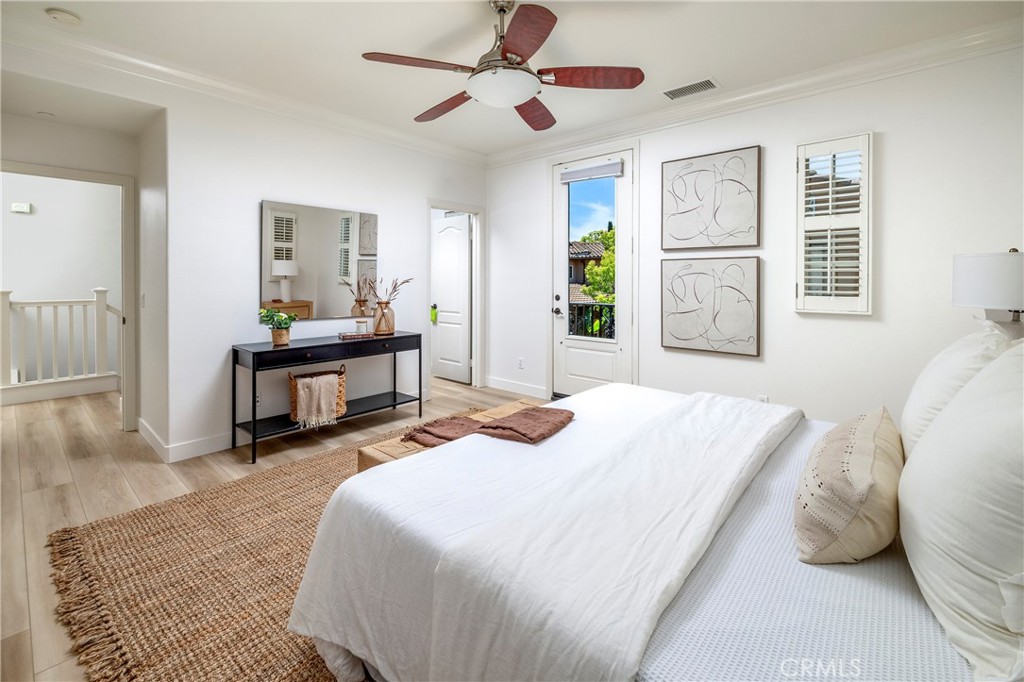 74 Townsend Irvine, CA 92620 - Photo 21 of 31 a bedroom with a bed and a chandelier