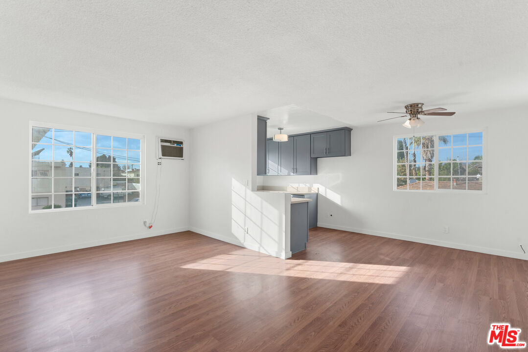 12325 Oxnard Street, Unit 6 North Hollywood, CA 91606 - Photo 2 of 11 a view of a kitchen with wooden floor and a window