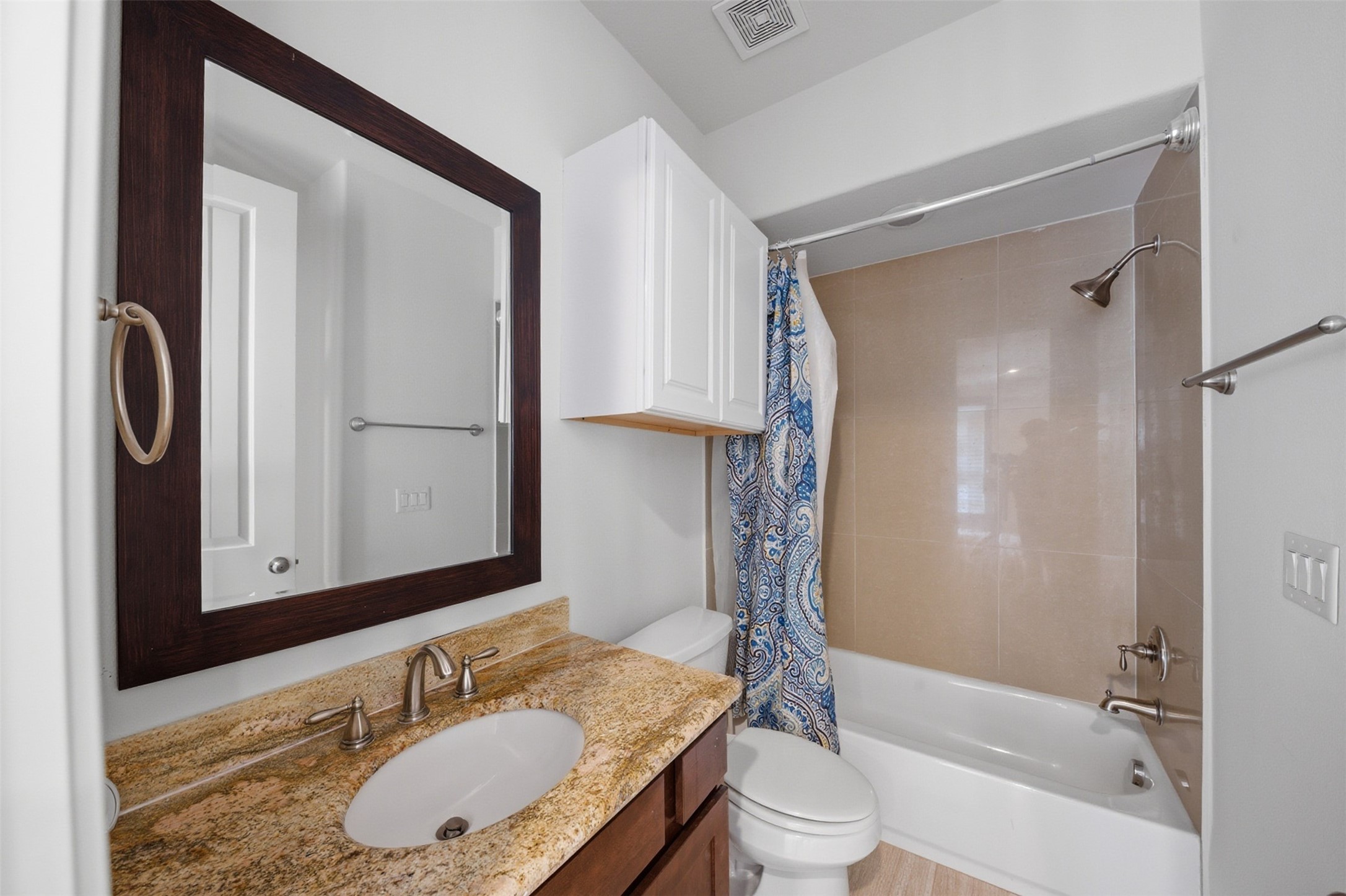 5606 Cohn Terrace Houston, TX 77007 - Photo 32 of 39 a bathroom with a granite countertop sink toilet and shower