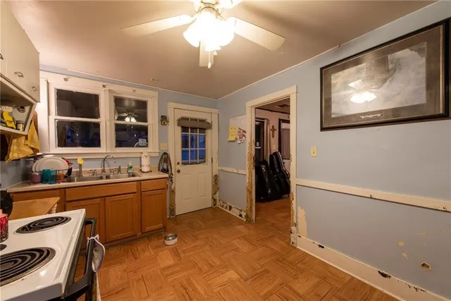 a view of a kitchen with a sink and cabinets
