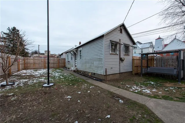a house view with a backyard space