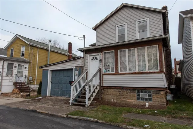 a front view of a house with stairs