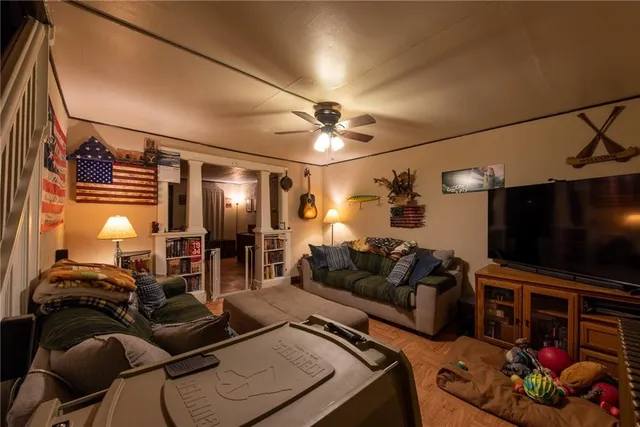 a living room with furniture and a flat screen tv