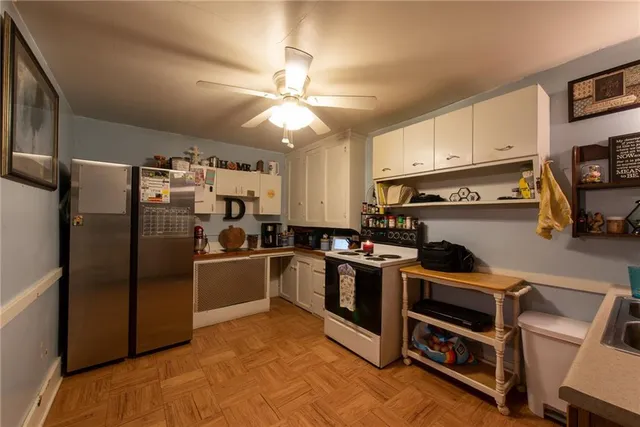 a kitchen with cabinets and steel stainless steel appliances