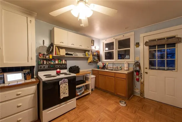 a kitchen with stainless steel appliances granite countertop a stove and a sink