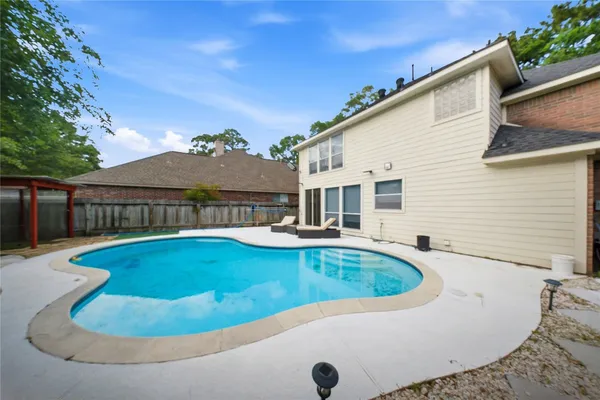 a view of a house with swimming pool
